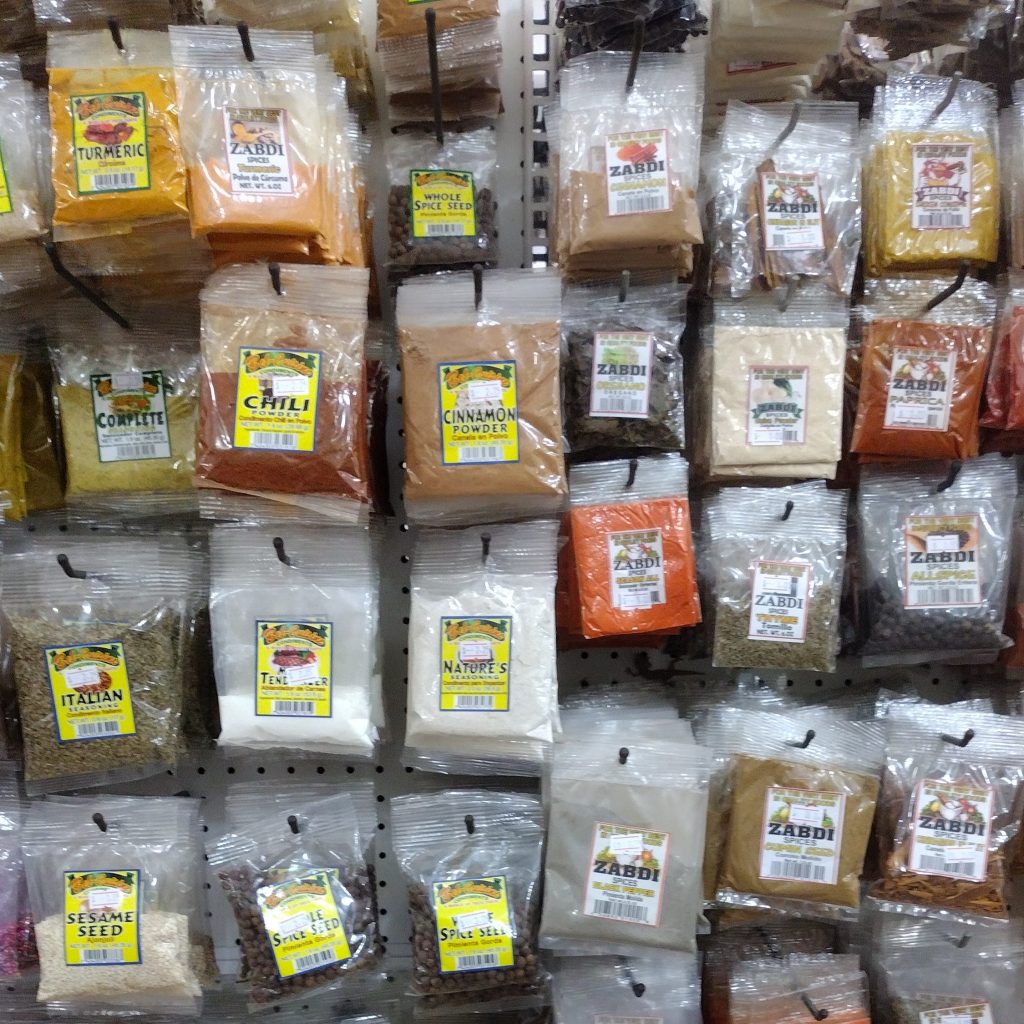 Vacation Rental Meal Planning Small Packets of Spices in Belize Grocery Store